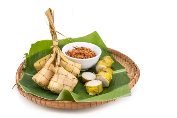 Photo of Ketupat, lemang, served with serunding, popular Malay delicacies during Hari Raya celebration