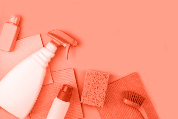 istock House cleaning products are on coral background. 1153219768
