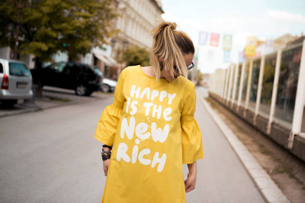 istock A young blonde is happy while walking in the street 1153219914