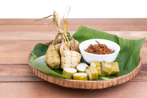 Photo of Ketupat, lemang, served with serunding, popular Malay delicacies during Hari Raya celebration