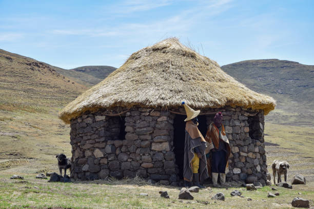 The Sotho people are a Bantu ethnic group of Southern Africa, native to modern Lesotho. Many Sotho people who still live in rural areas wear clothing which suits their lifestyles. The herders wear the Basotho blanket and large rain bootsas protection from wet mountain terrain. They also often wear woolen balaclavas or woolen caps throughout the year, to protect their faces from cold temperatures and dust blown by the mountain winds.
