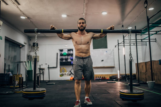 istock Male athlete exercising at the gym 1153221089
