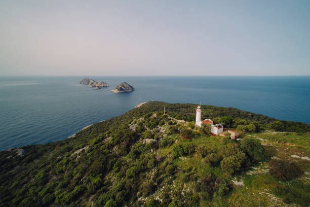 A photograph of Pokonji Dol Lighthouse just of the coast of Hvar in Croatia. The photograph was created on a beautiful summer day.