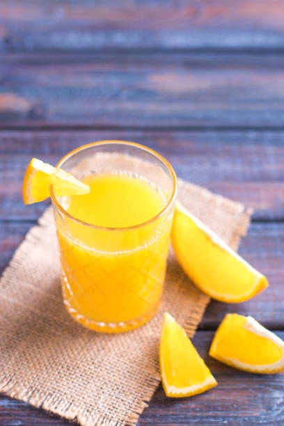 istock Fresh orange juice on the table,  rustic style 1153224884