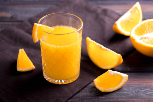 istock Fresh orange juice on the table,  rustic style 1153224993