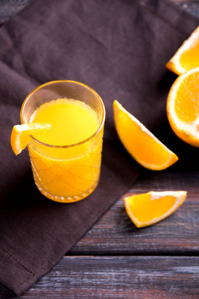 istock Fresh orange juice on the table,  rustic style 1153224998