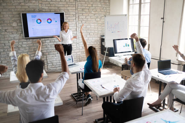 istock Successful happy group of people learning software engineering and business during presentation 1153225964