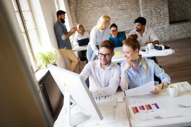 istock Business, technology and people concept - creative team or designers working in office 1153226056