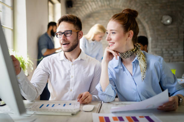 istock Happy creative team in office. Business, startup, design, people and teamwork concept 1153226068