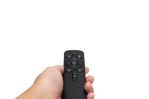 Smart remote control on hand on white background with clipping path.