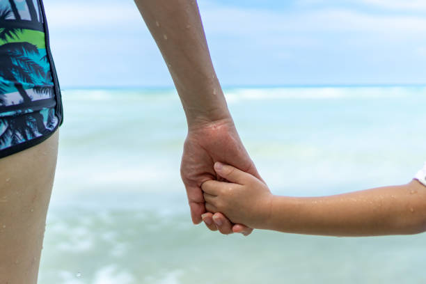 istock Mother and son on the beach 1153227350
