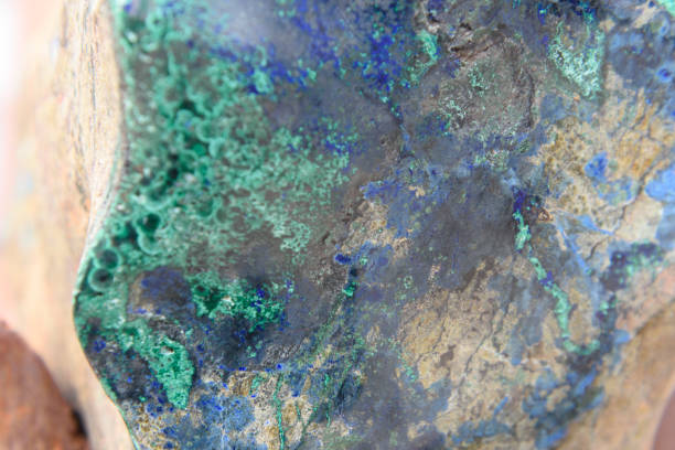 istock Copper Ore vein shows in a large rock. 1153228235