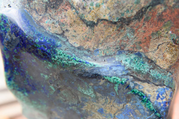 istock Copper Ore vein shows in a large rock. 1153228237