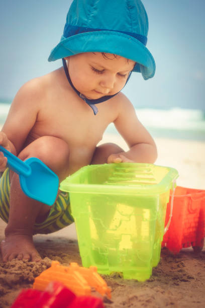 istock Happy little boy playing on the beach 1153229845