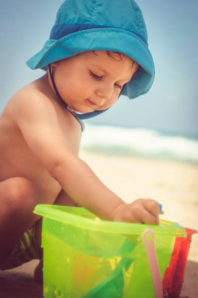 istock Happy little boy playing on the beach 1153229878