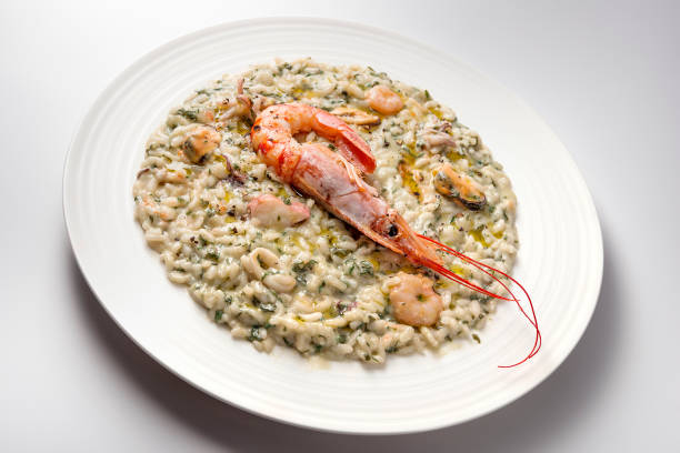 istock Risotto dish with spinach prawns and seafood 1153229935