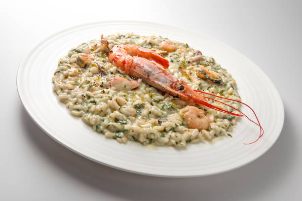 istock Risotto dish with spinach prawns and seafood 1153229974