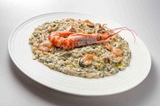 istock Risotto dish with spinach prawns and seafood 1153230008