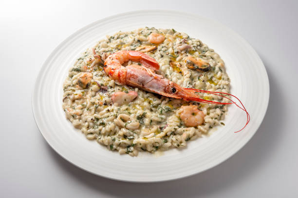 istock Risotto dish with spinach prawns and seafood 1153230053