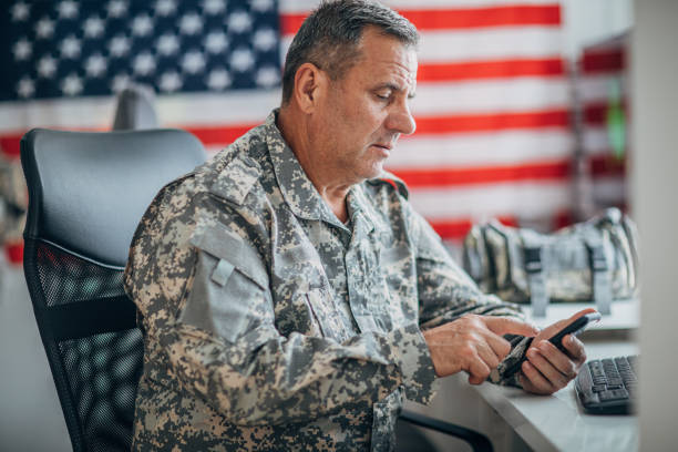 istock Senior soldier using smart phone 1153231030