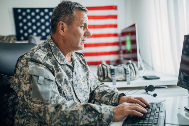 istock Senior soldier working at the office 1153231294