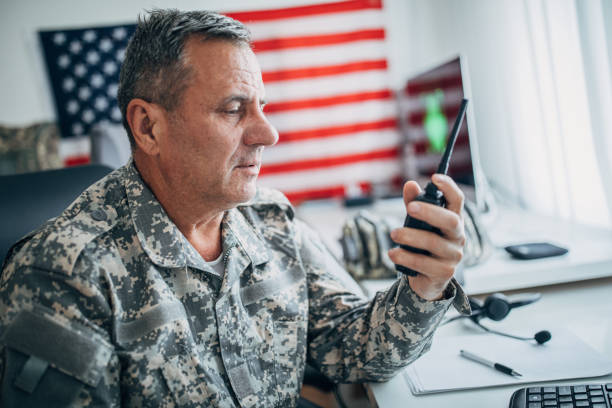 istock Senior soldier using walkie- talkie 1153231314