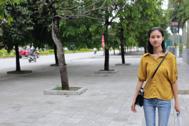 istock woman with umbrella in town 1153234029