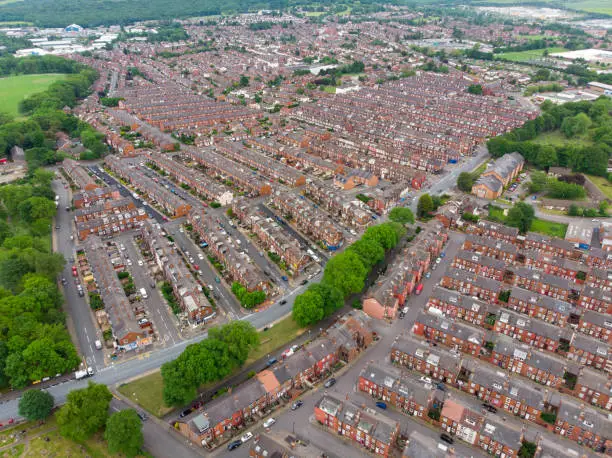 Aerial photo over looking the whole of Leeds from the Beeston area of the City Centre in West Yorkshire, the photo shows rows of 1940's terrace houses and playing fields.