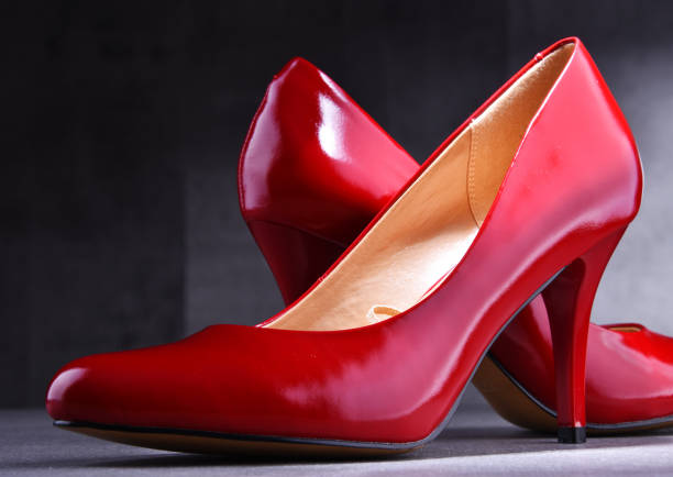 istock Composition with a pair of red high heel shoes 1153235235