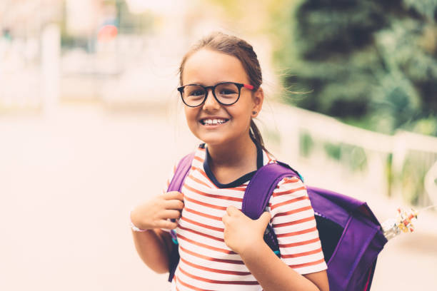 istock Back to school concept with happy schoolgirl 1153237174
