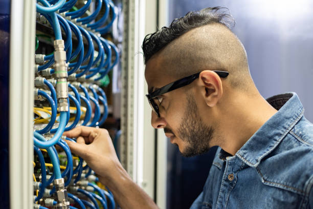 istock Busy Arabian engineer connecting broadband cables 1153237175