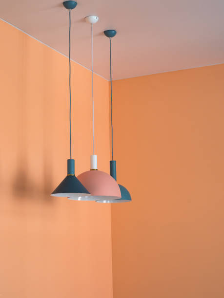 istock Pendant lights in orange interior. Orange room design with lights 1153237740