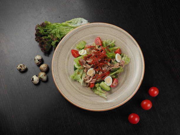 istock Healthy salad. Salad with boiled beef, vegetables and quail eggs 1153237846