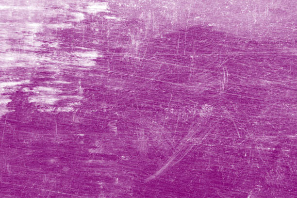 istock Grunge, dirty, scratched, unevenly colored purple background. 1153240208