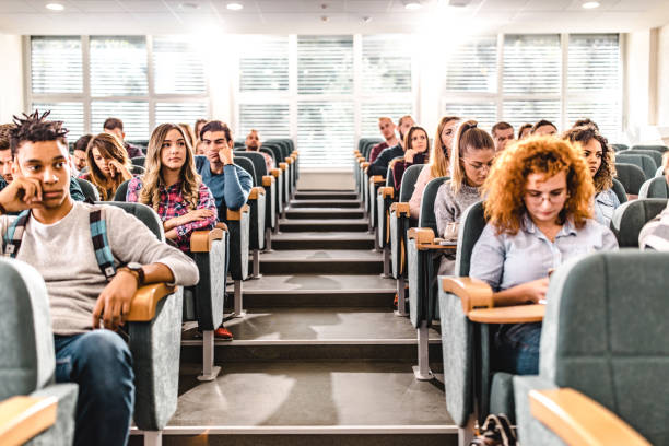 istock Large group of college students in a lecture hall. 1153242741