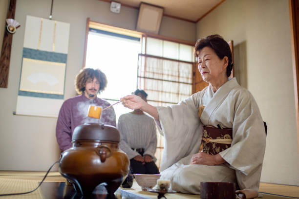 istock Japanese tea master performing a traditional Japanese tea ceremony 1153243602