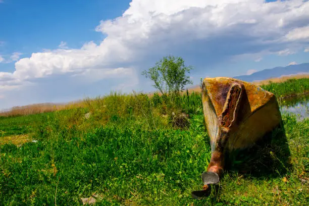 Photo of The boat upside down on the meadow