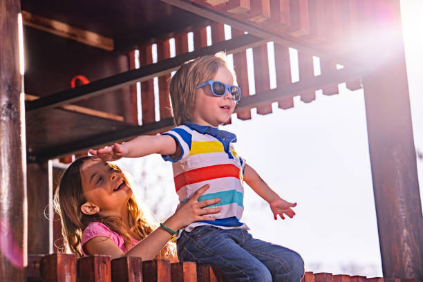 istock Cute children enjoying in playground 1153249960