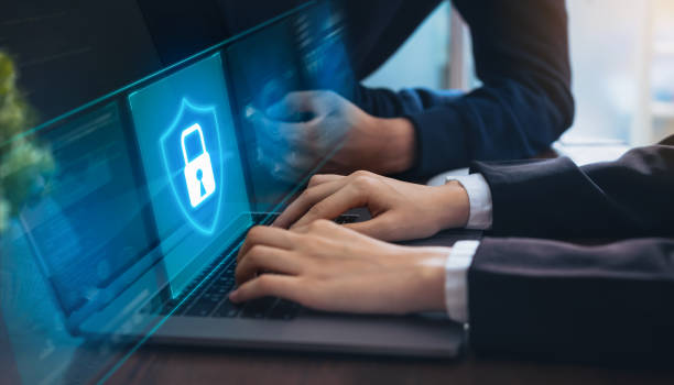 istock Technology concept with cyber security internet and networking, Businessman hand working on laptop, screen padlock icon on digital display. 1153250520