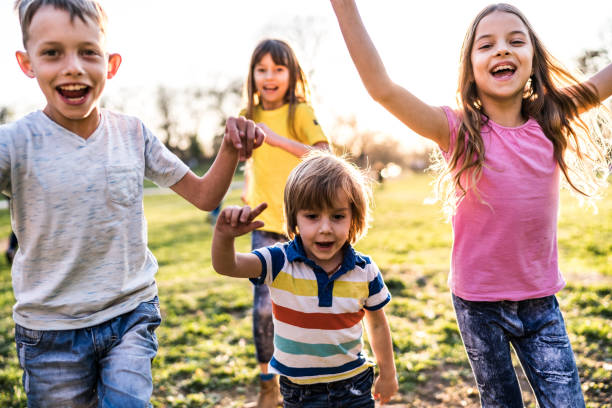 istock children run in the meadow 1153250794