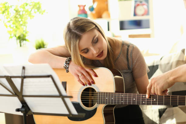 istock Guitar Playing Lesson Music Education Concept 1153251052