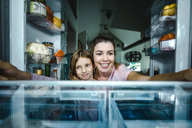 istock Sweetie, let's pick something to eat from a fridge! 1153251074