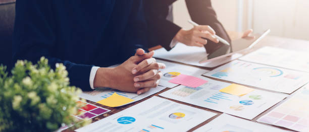 istock Business team using tablet working on the table and  financial documents in office. successful workplace strategy. proportion of the banner for ads. 1153251562