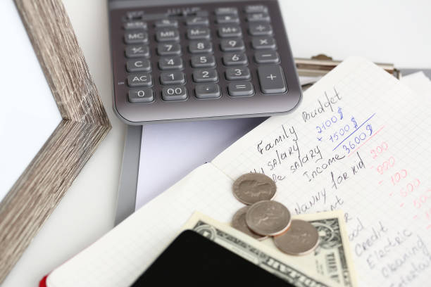 istock Family financial statistics written on notepad page lying on table 1153252989