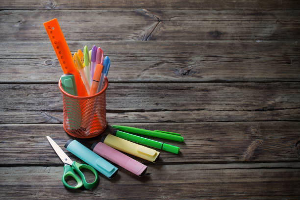 istock school supplies on dark old wooden  background 1153253341