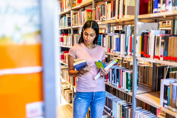 istock woman searching for a book 1153255995