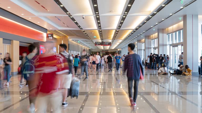 4K Resolution Time lapse Crowd in trade event exhibition hall. Business trade show,shopping mall and marketing advertisement concept,MICE industry business concept