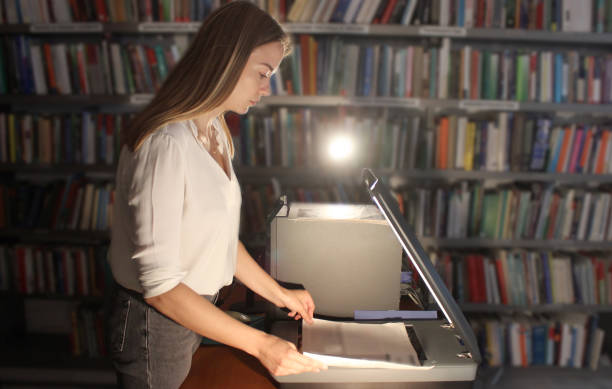 istock Young woman modern Librarian 1153258906