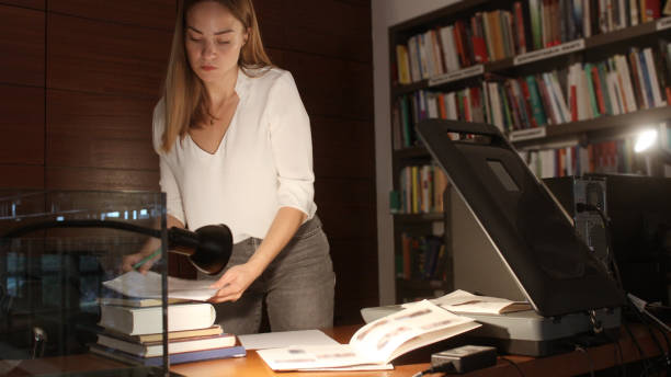 istock Young woman modern Librarian 1153258972
