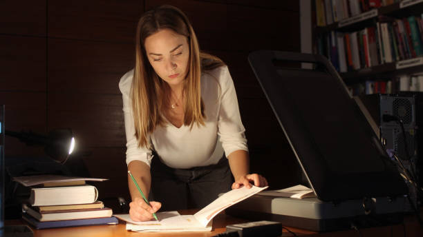 istock Young woman modern Librarian 1153259023
